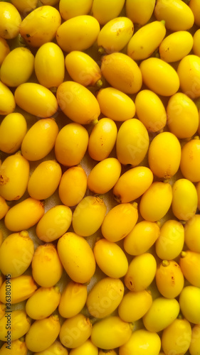 Yellow neem fruits close up full frame