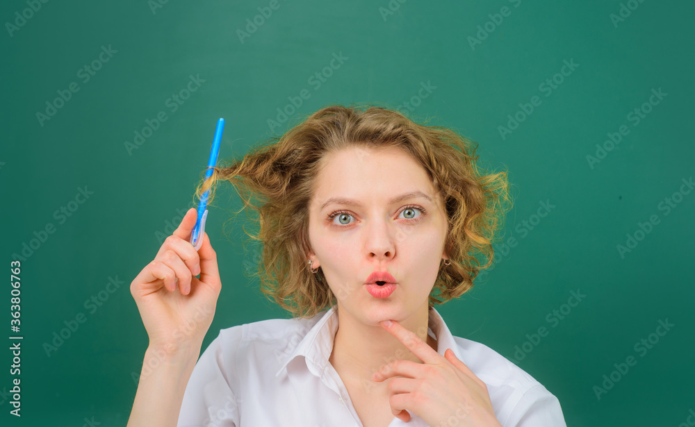 Obraz premium Surprised teacher. School subjects. Back to school. Portrait of female teacher with pencils. Pen. Pencils. Education. School. Job. Teacher in classroom.
