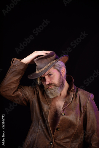 Sexy masculine stylish cowboy macho man. Vintage style man. Wild west retro cowboy.
