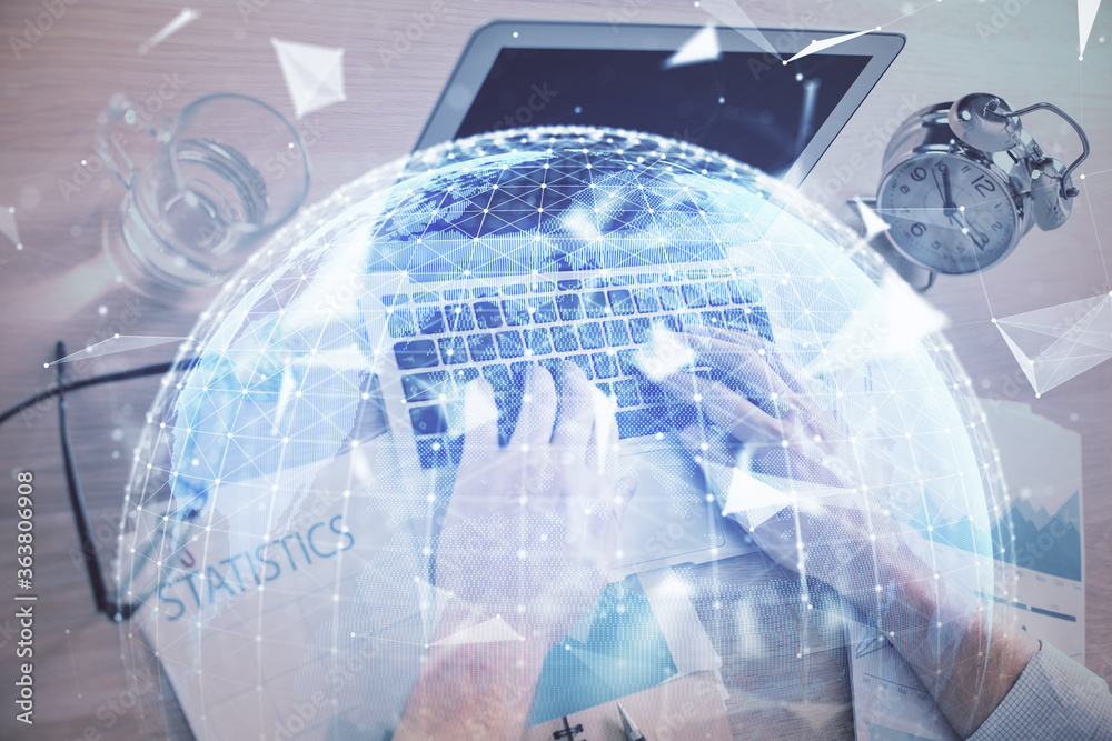 Multi exposure of businessman working on laptop on background. International business hologram in front. Concept of success. Multi exposure of businessman working on laptop on background. International business hologram in front. Concept of success.