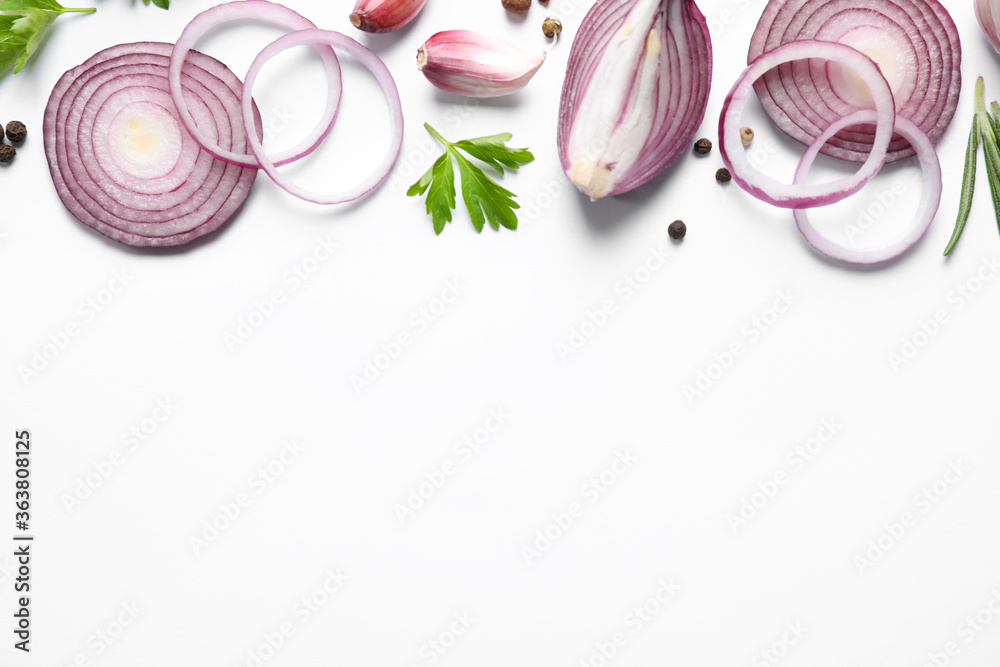 Flat lay composition with cut onion and spices on white background