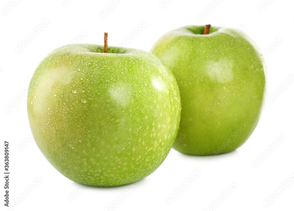 Fresh juicy green apples with water drops isolated on white