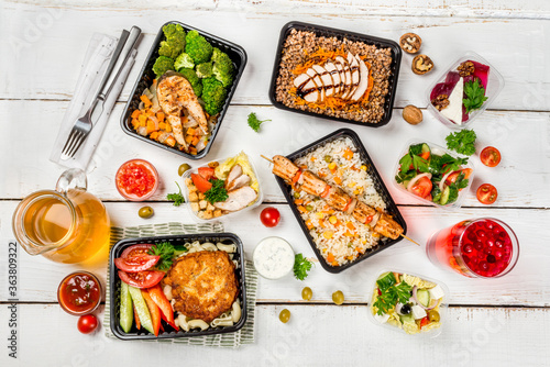 Several dishes in plastic containers shot from above