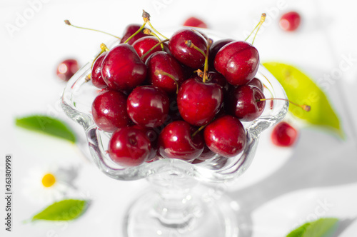 Fresh cherry in a tall glass isolated on white background. fresh ripe cherries. sweet cherries.