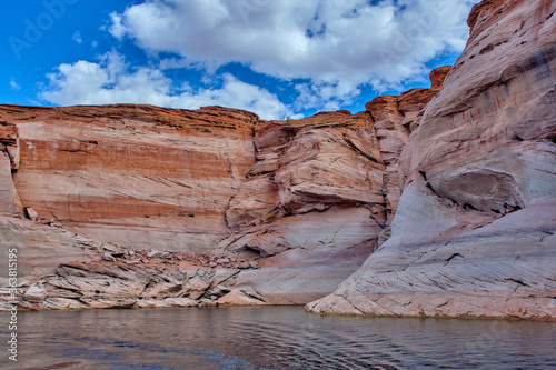 View of narrow  cliff-lined canyon from a boat in Glen Canyon National Recreation Area  Lake Powell  Arizona