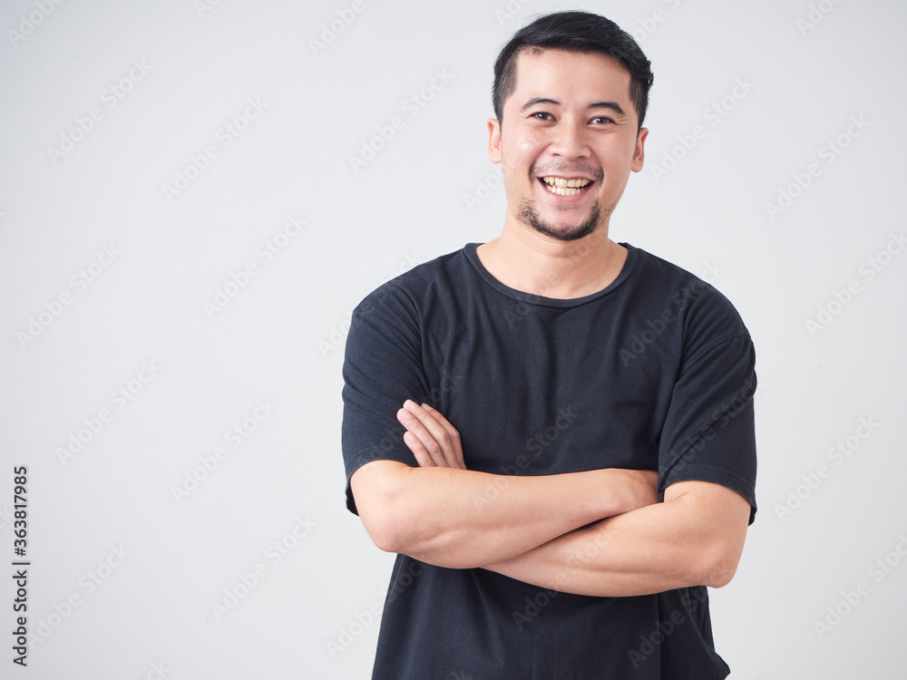 Young man crossed arms while standing. Young man crossed arms while standing.