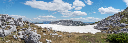 Panoramic landscape. The last snow on the Krippenstein mountain in the Dachstein Mountains. Salzkammergut. Austria