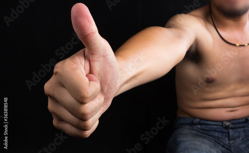 man with thumbs up - black background