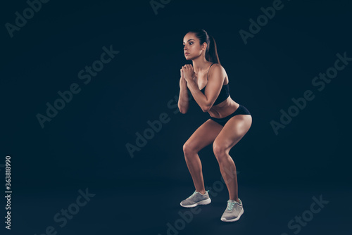 Full size profile photo short sport suit lady hands together body weight workout sit ups improve butt isolated black background
