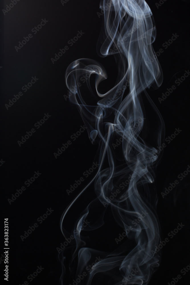 Obraz premium Fluffy Puffs of Smoke and Fog on Black Background