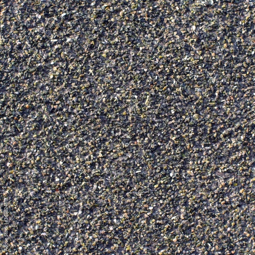 Multi-colored pebbles on a waterproofing canvas