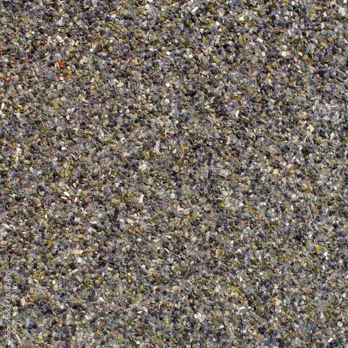 Multi-colored pebbles on a waterproofing canvas