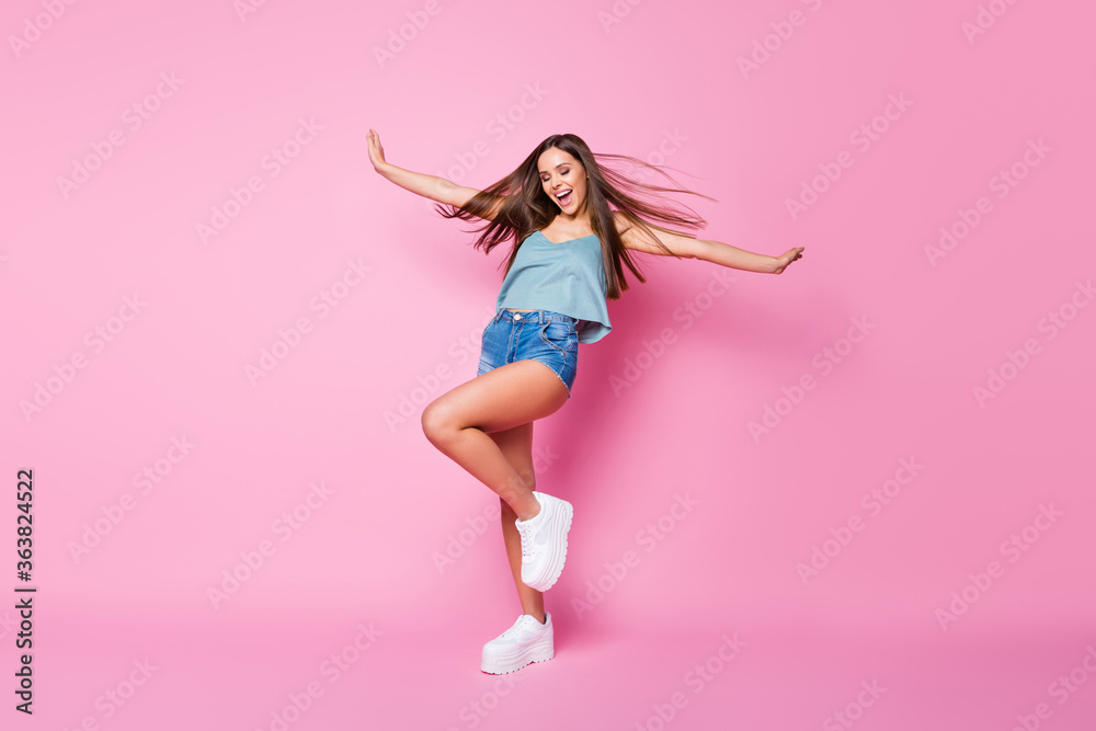Full length body size view of her she nice-looking lovely attractive fascinating cheerful cheery dreamy brown-haired girl having fun wind blowing hairstyle isolated over pink pastel color background