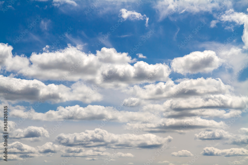 Fototapeta premium Blue sky background with white clouds