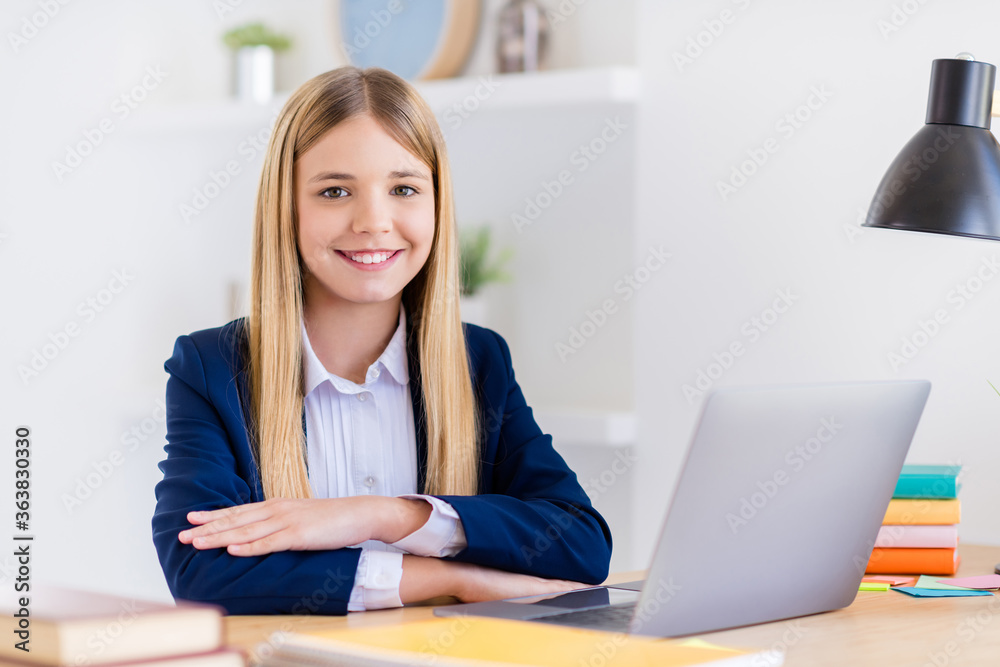 Close-up portrait of her she nice attractive intellectual cheerful small little long-haired girl using laptop attending web courses programming language in light white class room indoors Close-up portrait of her she nice attractive intellectual cheerful small little long-haired girl using laptop attending web courses programming language in light white class room indoors