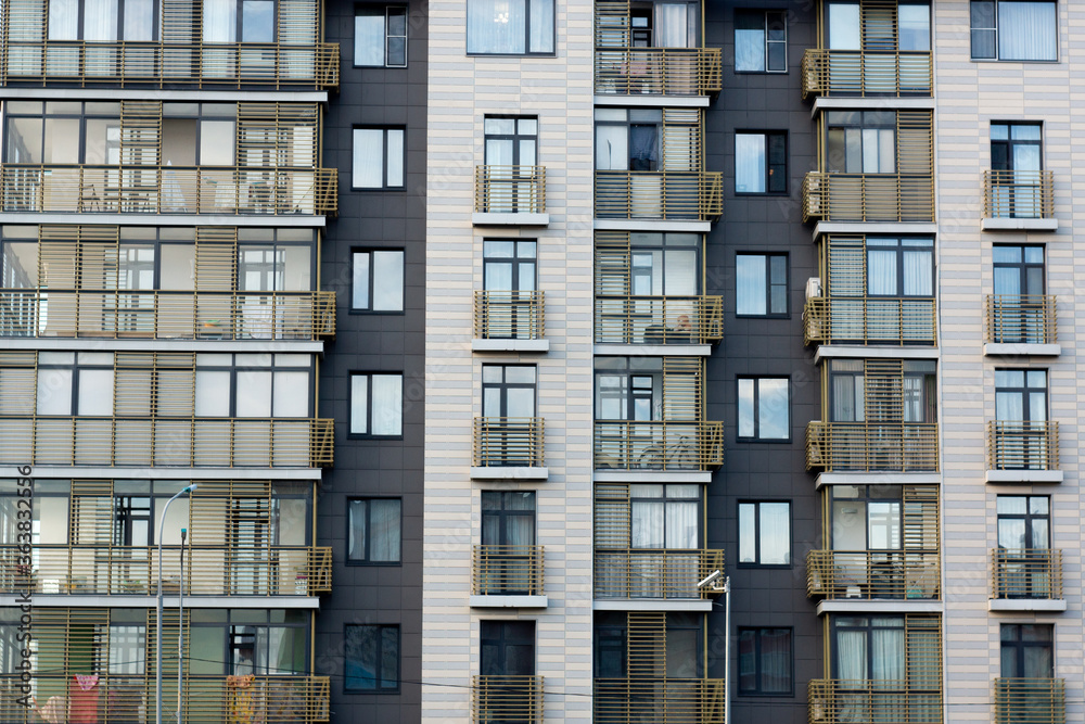 gray building facade with balconies