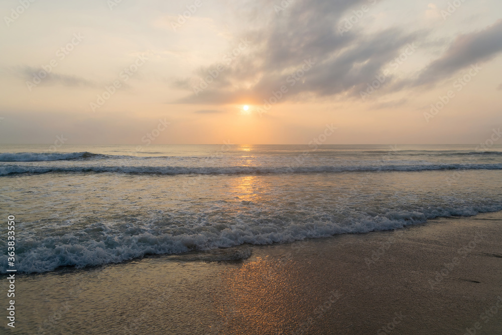 Obraz premium Sky and the sea on the sandy beach are shining bright and admirable in the morning