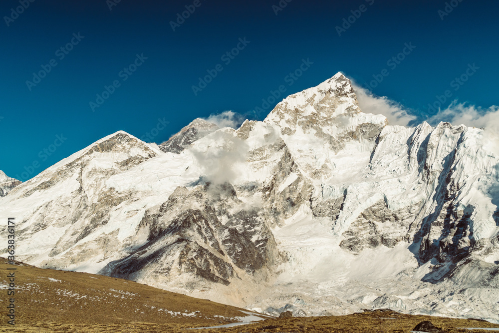 Beautifull Everest and Nuptse mountains landscape from the footpath on the Everest Base Camp trek in the Himalaya, Nepal. Everest and Lhotse view.