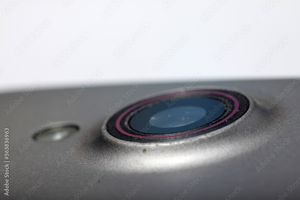 Fototapeta premium Macro shot of a smartphone camera on a white isolated background