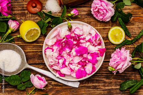 Ingredients for cooking rose petals jam. Sugar, lemon, fragrant flowers