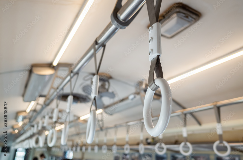 white handle on the ceiling