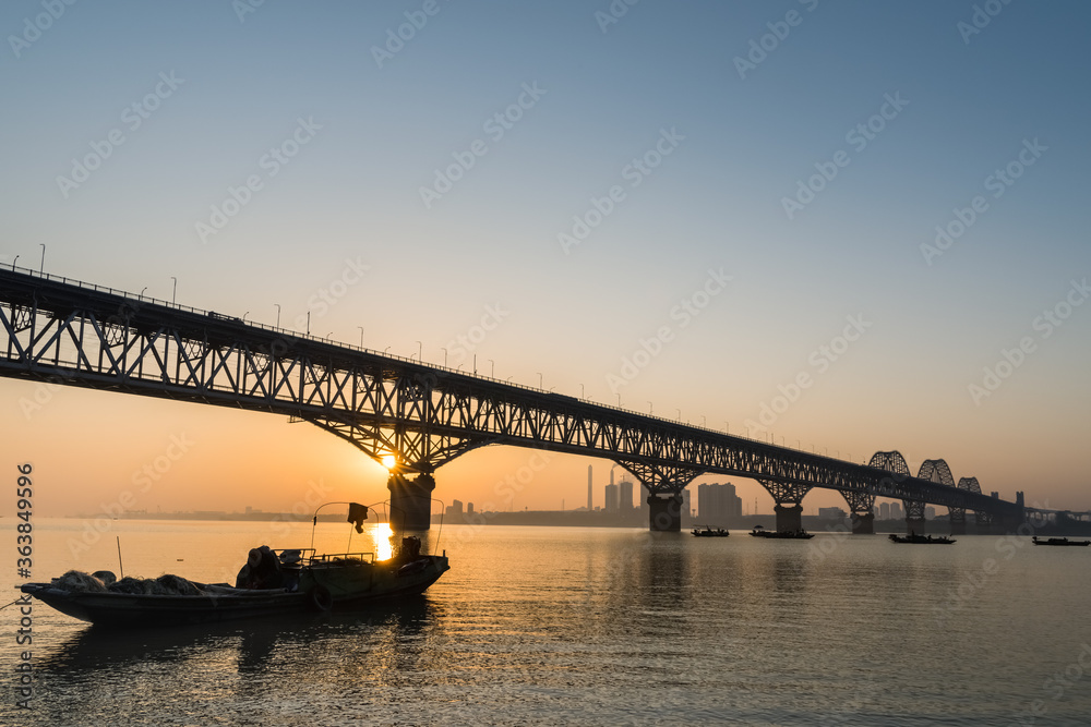 jiujiang highway and railway combined bridge in sunrise