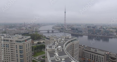 Aerial view of Saint-Petersburg, Russia. The Kantemirovsky bridge, the Neva River and the television tower. Busy traffic in cloudy weather. 4K photo