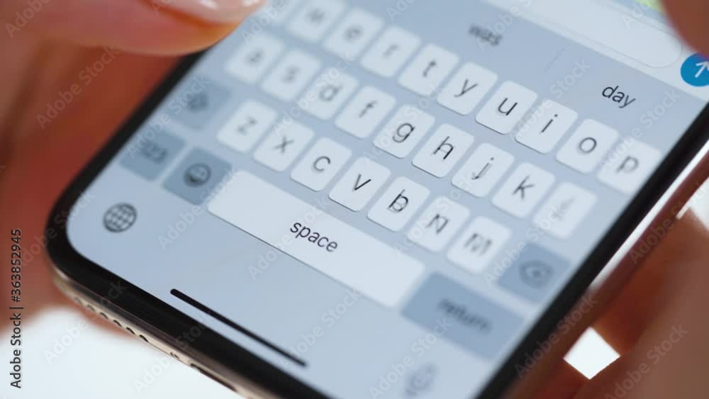 Hands typing text on smartphone close-up Hands typing text on smartphone close-up