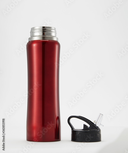 Full length red aluminium waterbottle. Isolated on white background.