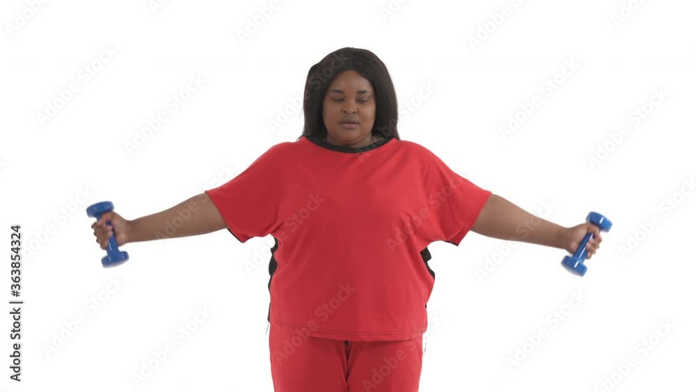 Portrait of black woman with overweight lifting dumbbells up isolated on white background
