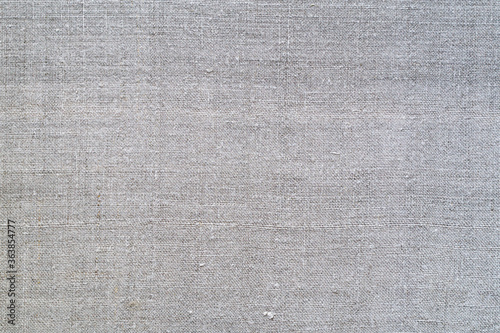 Texture of old homespun linen fabric. Rough textile