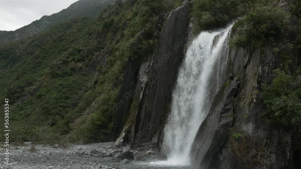 Beautiful Waterfall coming from Rainforest in New Zealand