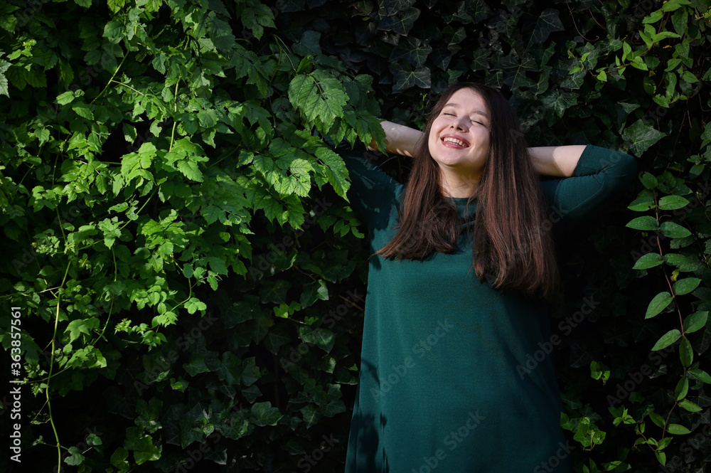 Young Woman Relaxing In The Forest Young Woman Relaxing In The Forest