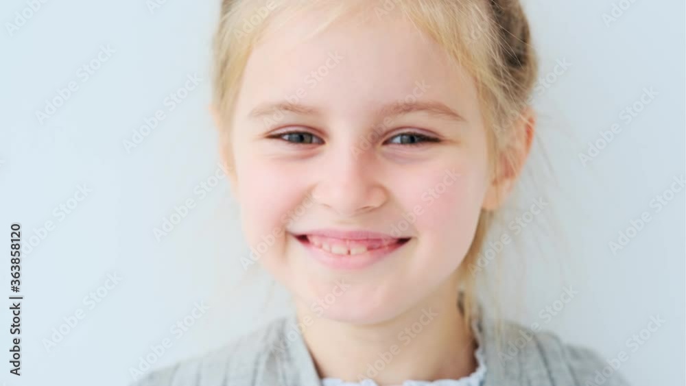 Portrait of smiling girl on blurred background Portrait of smiling girl on blurred background