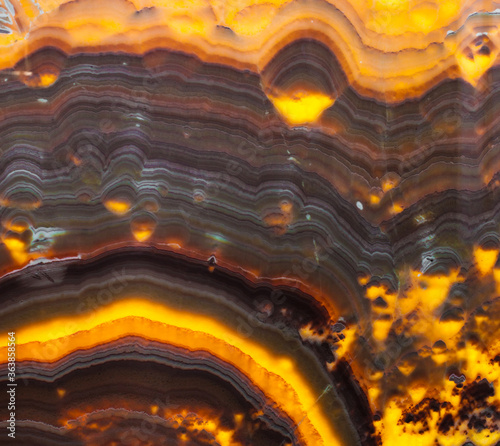 Brown and yellow orange striped natural onyx texture