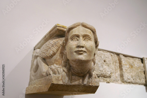 isolated medieval sculpture depicting a chimera