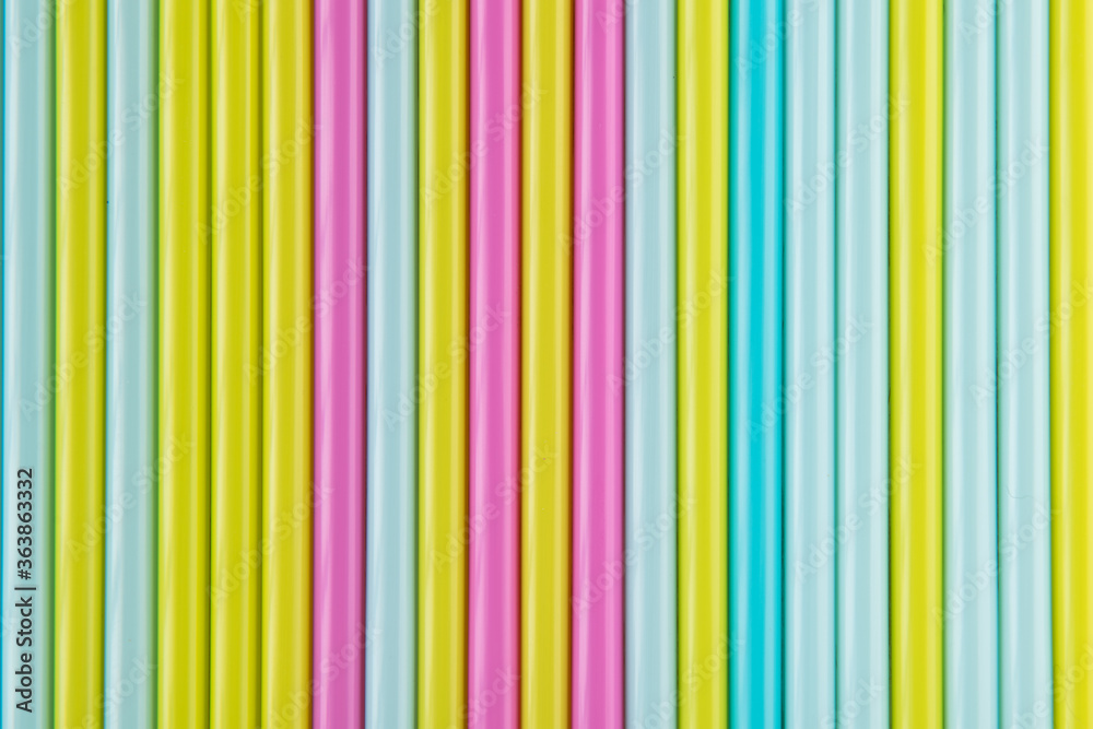 Fototapeta premium colored tubes for cocktails for a party, pattern