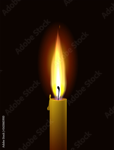 Candle flame. Realistic burning paraffin candle on a black background