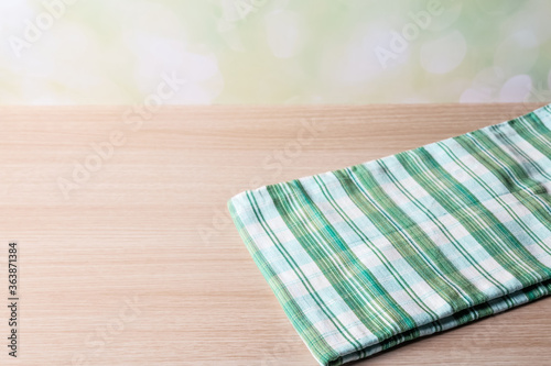 green table cloth on wood table