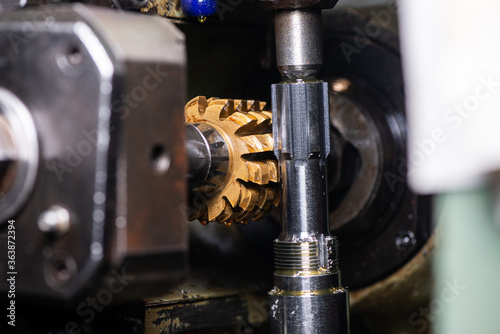 gear cutting machine close up. production of metal parts.