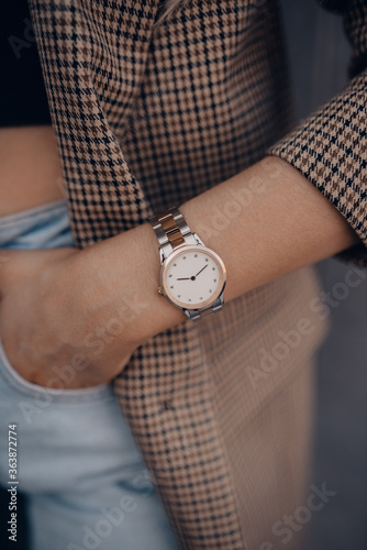 Stylish beautiful elegant white watch on woman hand