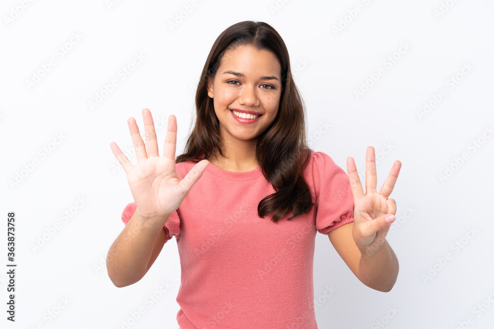 Young Colombian girl over isolated white background counting eight with fingers Young Colombian girl over isolated white background counting eight with fingers