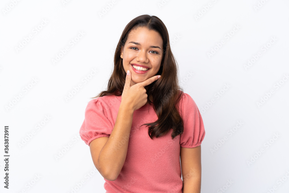 Young Colombian girl over isolated white background smiling Young Colombian girl over isolated white background smiling