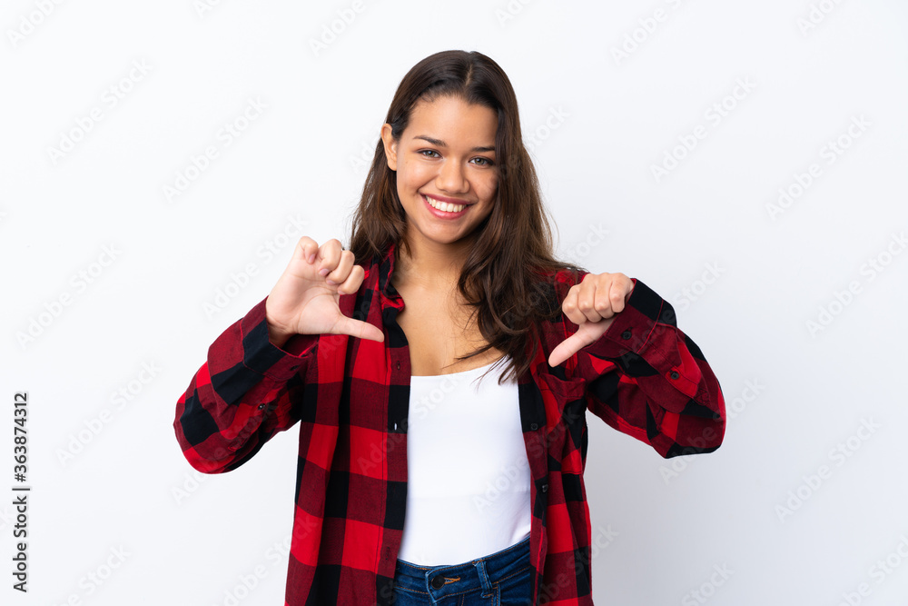Young Colombian girl over isolated white background proud and self-satisfied Young Colombian girl over isolated white background proud and self-satisfied
