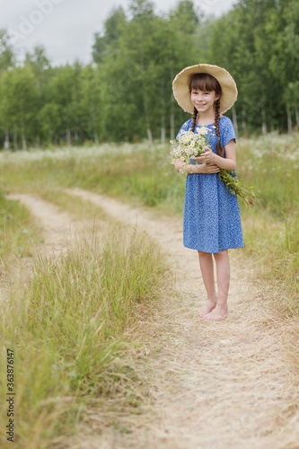 summer portrait of adorable girl with chamomiles bunch © Albert Ziganshin