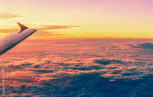Flying aircraft wind on sunset sky view from window of airplane © NtDanai