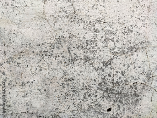 Grey Concrete Texture old wall with peeling paint, scratches and cracks © onphotoua