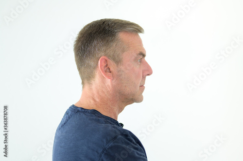 Side view pose of a serious thoughtful man