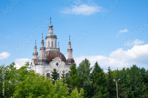 old church on a background of beautiful sky and green trees