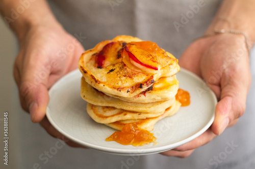 hand holding pancakes